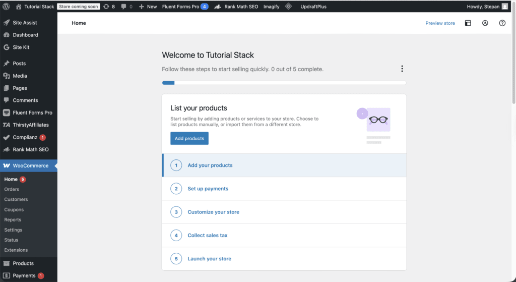 WordPress admin with WooCommerce setup dashboard showing product, payment and store setup steps